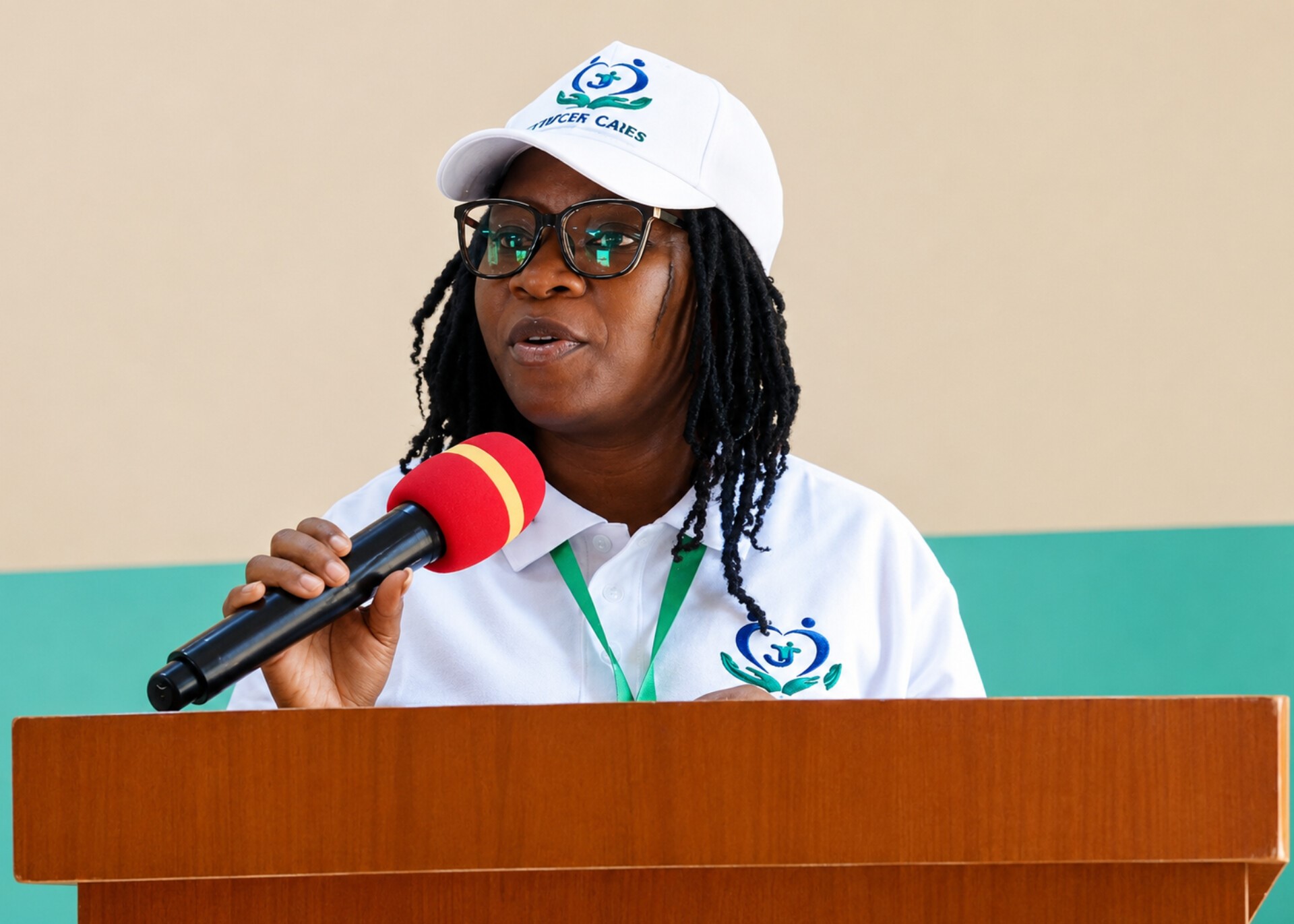 A TIJCEF team member speaking during a community programme